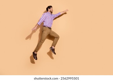 Photo of brunet hair adult jumping employee office manager fist up strong leader superhero isolated on beige color background - Powered by Shutterstock