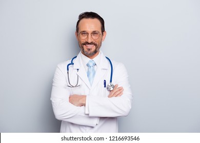 Photo of brunet hair bristle doc assistant folded hands over chest stand isolated on light gray background with hollywood smile - Powered by Shutterstock