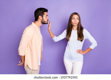 Photo Of Brunette People Man Send Air Kiss Woman Refuse Hand Waist Ignore Isolated On Purple Color Background
