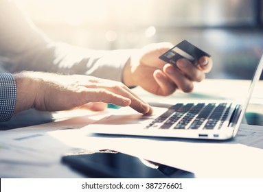 Photo businessman working with generic design notebook. Online payments, banking, hands keyboard. Blurred background, film effect. horizontal mockup - Shutterstock ID 387276601