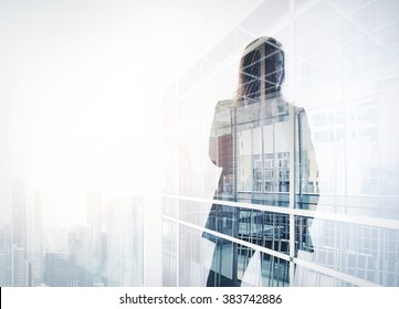 Photo of businesswoman. Double exposure, city on the background. Blurred background, horizontal