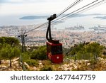 Photo of cable car to Mount Faron, view of French city Toulon in background.