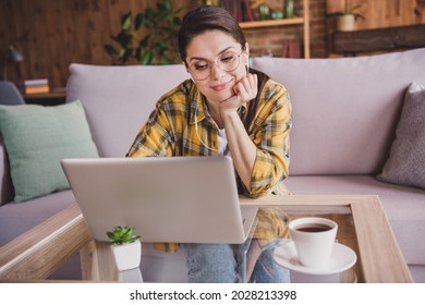 Photo Of Calm Peaceful Happy Woman Look Laptop Watch Film Wear Glasses Headphones Indoors Inside House Home