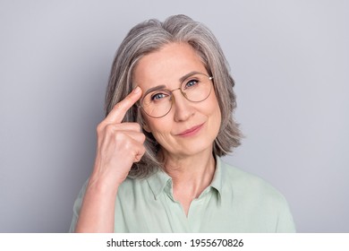 Photo Of Calm Peaceful Minded Thoughtful Woman Point Finger Forehead Remember Isolated On Grey Color Background