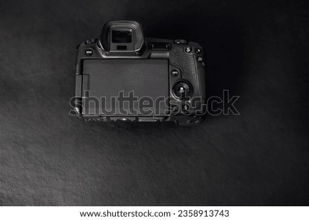 Photo camera mirrorless camera isolated on black background