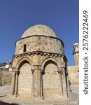 The photo captures the Chapel of the Ascension, located on the Mount of Olives in Jerusalem. This historic site commemorates the ascension of Jesus into heaven, according to Christian tradition. 