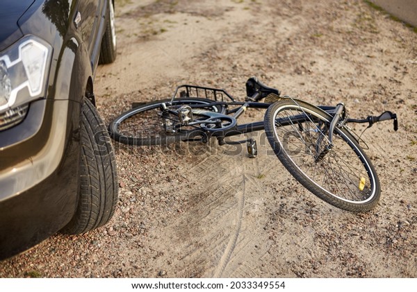 Photo of car and bicycle on the road, the\
concept of road\
accidents.