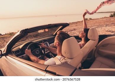 Photo Of Carefree Adorable Married Couple Dressed White Clothes Driving Car Rising Scarf Smiling Outdoors Country Side Road