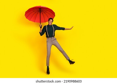 Photo of carefree butch short hair lady guy jump parasol wear fashion stylish trendy unisex shirt isolated vivid color background - Shutterstock ID 2190988603