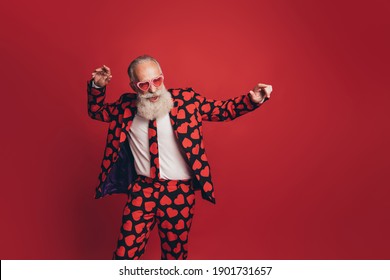 Photo Of Carefree Funky Old Man Vintage Retro Disco Dance Wear Heart Print Suit Isolated Red Background