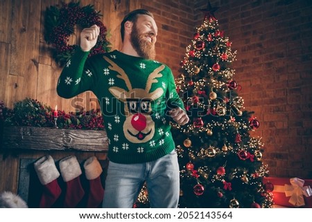 Photo of carefree inspired funny ginger bearded man dance party wear deer pullover decorated office indoors
