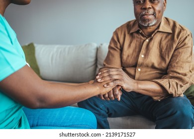 Photo Of Caring Nurse Or Doctor Holding An Elderly Hand With Care. Nurse Physiotherapist Doctor Holding Hands Of A Senior Or Elderly Old Man Patient With Love, Care, Helping, Encourage And Empathy 