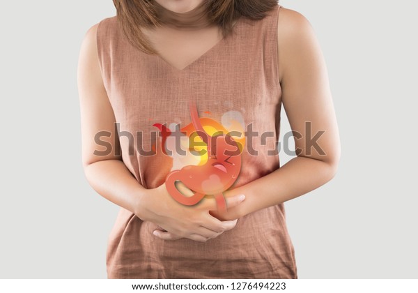 The Photo Of Cartoon Stomach On Woman\'s Body\
Against White Background, Acid Reflux Disease Symptoms Or\
Heartburn, Concept With Healthcare And\
Medicine