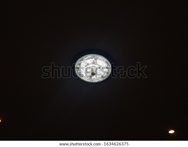 Photo of ceiling\
lighting in office in at\
Laos
