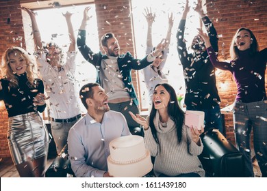 Photo Of Celebrating Best Friends Arranging Unexpected Surprise Baby Party Future Parents Sit Sofa Hold Big Cake Confetti Fall Wear Formalwear Restaurant Indoors