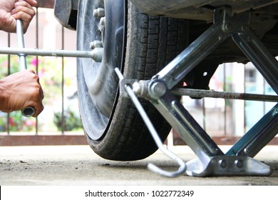 Photo For Changing Spare Tire When The Tire Broken Down On The Front Of The House. Taken On February 2018, Kota Kinabalu, Sabah, Malaysia.