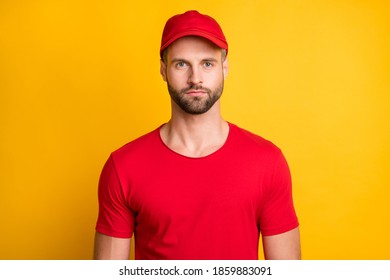 Photo Of Charming Calm Young Bearded Man Serious Look Camera Wear Red T-shirt Headwear Isolated Yellow Color Background