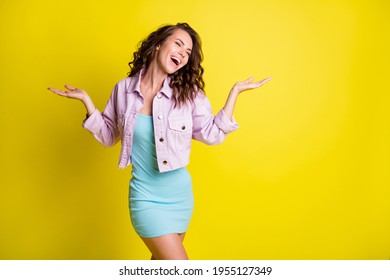 Photo Of Charming Cheerful Lady Closed Eyes Raise Arms Palms Open Mouth Smile Isolated On Yellow Color Background