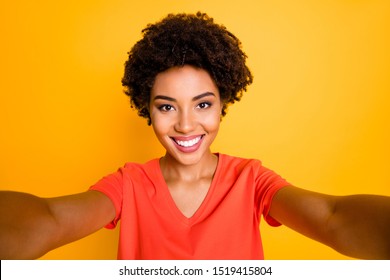 Photo of charming cute cheerful sweet nice girlfriend taking selfie recording video influencing her audiences while isolated over yellow bright color background - Powered by Shutterstock