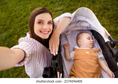 Photo Of Charming Cute Positive Mommy Blogger Walk Sleeping Infant Kid Pram Make Selfie Portrait Outside