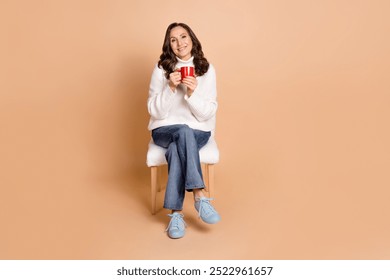 Photo of charming cute woman wear white trendy clothes sit chait enjoy weekend isolated on beige color background - Powered by Shutterstock