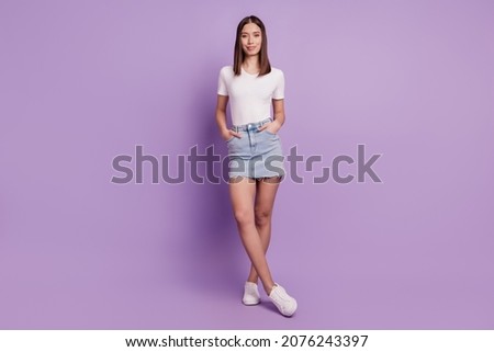 Photo of charming gorgeous sweet nice lady hands pockets posing on violet background