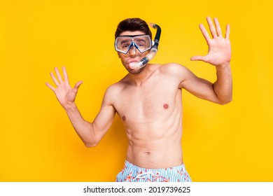 Photo Of Charming Impressed Young Man Naked Torso Wear Goggles Breathing Tube Smiling Isolated Yellow Color Background