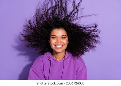 Photo Of Charming Positive Lady Flying Hair Toothy Smile Look Camera Isolated On Purple Color Background