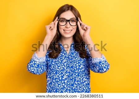 Photo of charming pretty lady wear print shirt arms spectacles smiling isolated yellow color background