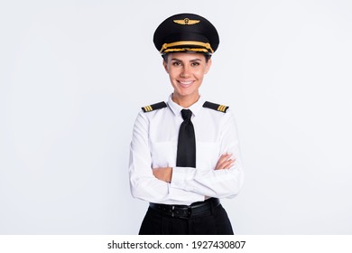 Photo of charming self-assured pilot lady crossed hands wear hat aviator uniform isolated white color background