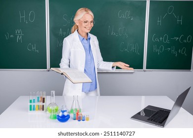 Photo of charming senior woman school teacher wear white robe distance seminar isolated on green board background - Powered by Shutterstock