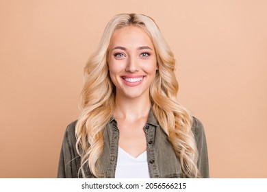 Photo Of Charming Young Happy Woman Smile Good Mood Blonde Hair Enjoy Isolated On Pastel Beige Color Background