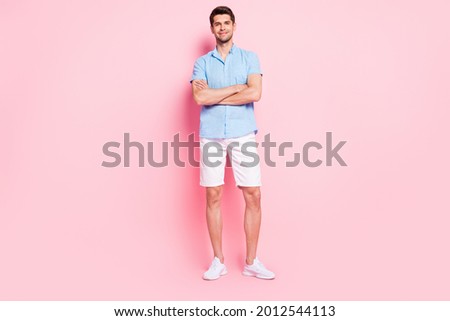 Photo of cheerful business man folded hands wear blue shirt shorts shoes isolated on pink color background