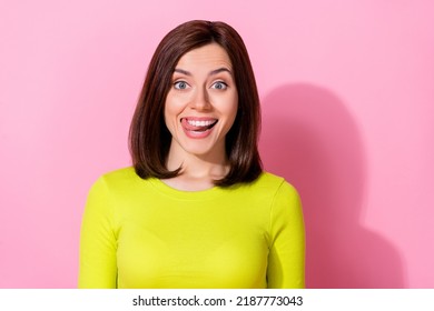 Photo Of Cheerful Charming Girl Tongue Lick Teeth Beaming Smile Isolated On Pink Color Background