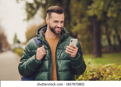 Photo of cheerful charming person write comment carry bag toothy smile wear fall style clothing walking outdoors - Powered by Shutterstock