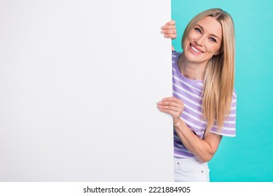 Photo Of Cheerful Cute Pretty Woman Hiding White Wallpaper Empty Space For Advertisement New Shopping Center Isolated On Aquamarine Color Background