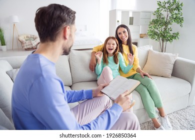 Photo of cheerful family happy positive smile laugh dad read book novel funny story loud sit couch indoors - Shutterstock ID 1926850364