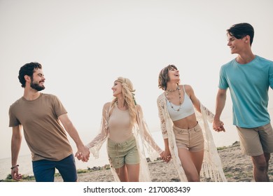 Photo Of Cheerful Friends Hold Hands Hippie Road Trip Adventure Happy End Wear Boho Outfit Nature Seaside Beach Outside