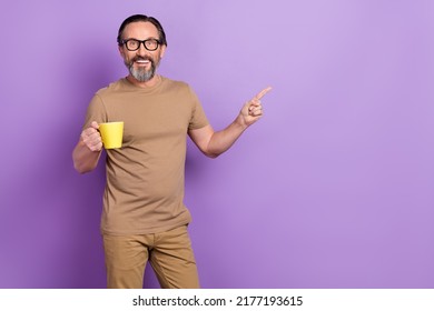 Photo Of Cheerful Funny Businessman Have Break From Work Advertise Promote Coffee Shop Isolated On Purple Color Background