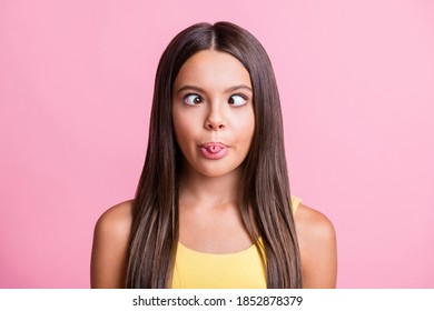 Photo of cheerful funny girl rolled tongue make eyes look at each other isolated pink color background - Powered by Shutterstock