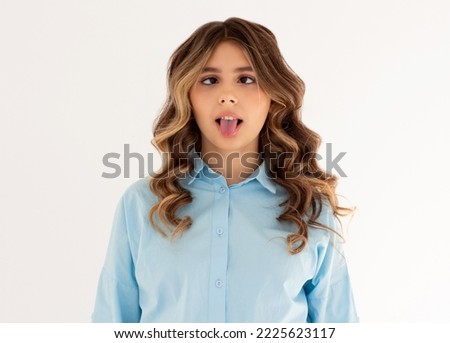 Photo of cheerful funny girl rolled tongue make eyes look at each other isolated white color background