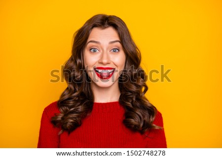 Photo of cheerful glad cute charming pretty fascinating gorgeous girlfriend fooling sticking tongue out smiling toothily beaming isolated over yellow bright color background
