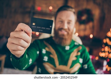 Photo Of Cheerful Happy Young Man Hold Credit Card Good Mood Holiday Sale Indoors Inside House Home