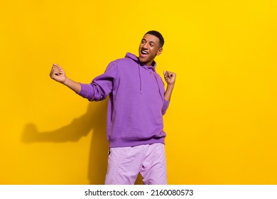 Photo of cheerful hipster guy spend evening in nightclub enjoying discotheque isolated on yellow color background - Powered by Shutterstock