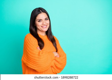 Photo Of Cheerful Lady Crossed Hands Beaming Smile Wear Orange Pullover Isolated Turquoise Color Background