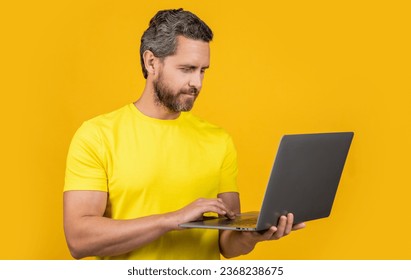 photo of cheerful man blogger with laptop. man blogger isolated on yellow. man blogger - Shutterstock ID 2368238675