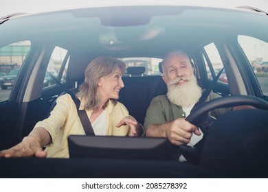 Photo of cheerful mature couple conversation ride rant car steering-wheel careful weekend vacation outdoors - Powered by Shutterstock