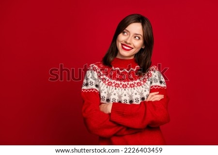 Photo of cheerful nice gorgeous girl straight hairstyle dressed red sweater look empty space arms crossed isolated on red color background