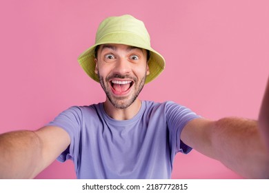 Photo of cheerful optimistic guy tourist trendy outfit good mood take photo rest vacation good weekend isolated on pink color background - Shutterstock ID 2187772815