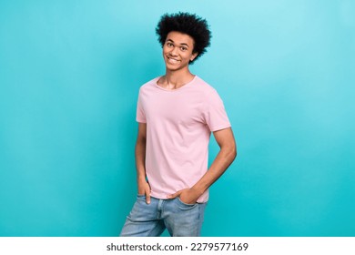 Photo of cheerful optimistic stylish wearing young hipster guy wear pink t-shirt hands pockets advert clothes sale isolated on blue color background - Shutterstock ID 2279577169